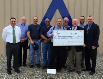 ALOFT presents check to Beebe Medical Foundation.