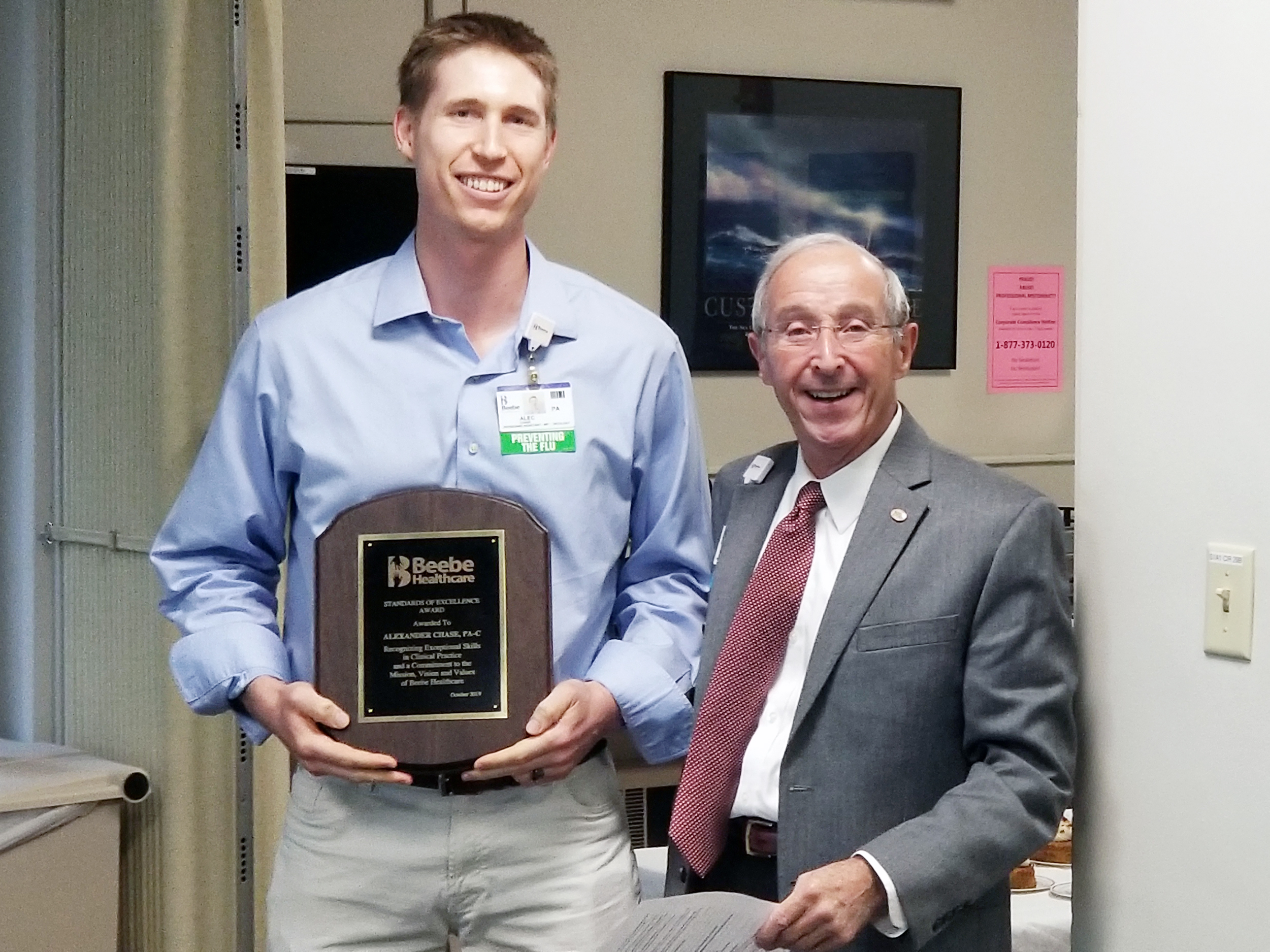 The first Advanced Practice Provider award went to Alexander Chase, PA-C, who poses with David Herbert, Chair of Beebe Board of Directors.