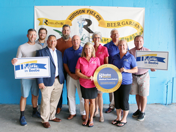 From left to right: Patrick Staggs, Co-founder Revelation Craft Brewing; Louis Schlecker, Revelation Beer Garden at Hudson Fields Bar Manager; Michael Maksymow, Chief Information Officer at Beebe; Christian Hudson, Chair, Beebe Medical Foundation Board an