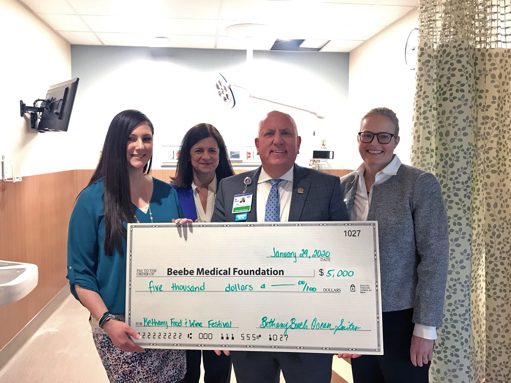 Lorrie Miller, General Manager, Bethany Beach Ocean Suites, Susan Todaro, Activities Director, Bethany Beach Ocean Suites, Tom Protack, President, Beebe Medical Foundation, and Kay Young, Vice President of Development, Beebe Medical Foundation, pose for a