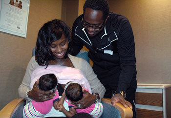 Brittany Hazzard, Reginald Hazzard, and their twin girls