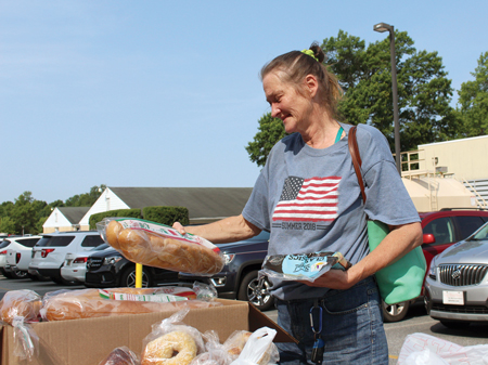 Debbie selects food during the monthly Beebe Prescription Food Program. Debbie selects food during the monthly Beebe Prescription Food Program.