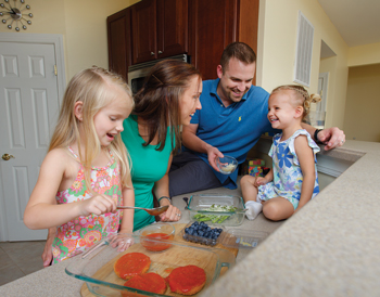 Dr. Farrell and family preparing dinner.