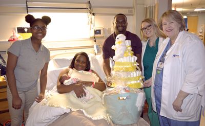 Shown (left to right) are Zhane Maull, Amileyon and Cevon Maull, Mark Williams, Dr. Katrin Arnolds of Beebe Women’s Healthcare – Plantations, and Lisa Klein, Nurse Manager, Beebe Women’s Health. 