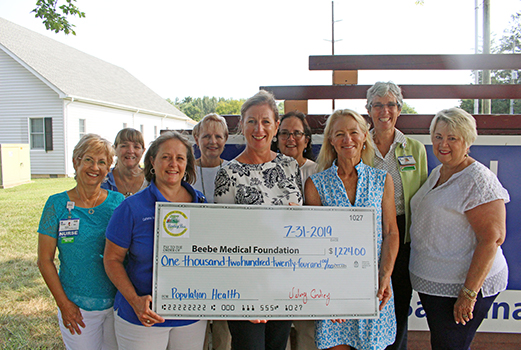 Shown are Mary Summerville, RN; Barbie Robets, Administrative Secretary; Catherine Murphy, MSN, RN; Stephanie Williams, RN, Kim Blanch, RN, Community Services Manager; Kathi Fryling, Food Services; Valery Cordrey, of East Coast Garden Center; Diane Barlow