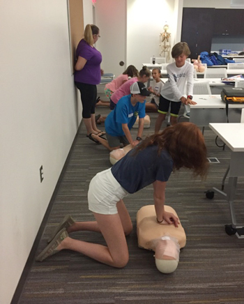 Margaret H. Rollins School of Nursing hosts babysitting classes. Students practice newly mastered CPR skills 