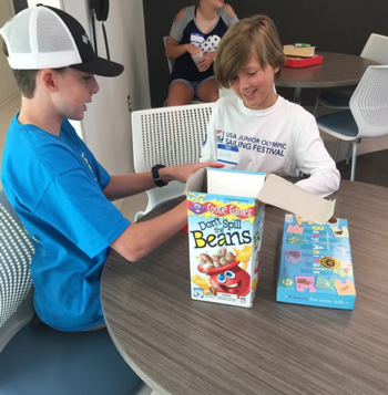 Aiden Bowman and Bailey Fletcher practice playing board games on their lunch break