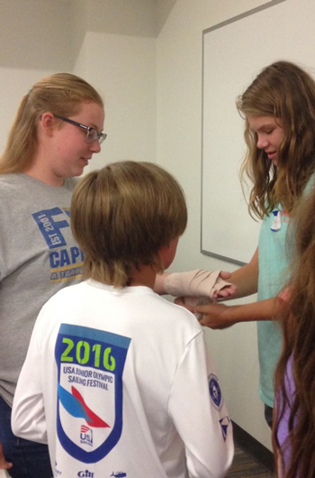 Students practice first aid.