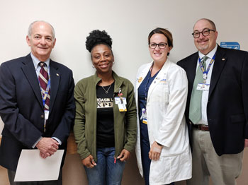 Liz Boone, CNA at Beebe Healthcare, (second from left) is the June 2018 recipient of the L.O.V.E. Letter Award. Also pictured from left to right are Jeffrey Fried, President and CEO, Jamie Dickerson, Nurse Manager, and Rick Schaffner, Executive Vice Presi
