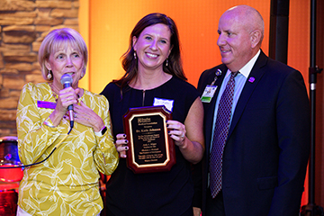 Judy Aliquo, President & CEO, Beebe Medical Foundation, awards Katie Johnson, DO, Medical Director of Palliative Care, the 2019 Philanthropy award as Tom Protack, Vice President, Beebe Medical Foundation, looks on Thursday, Oct. 3 at the Fairfield Inn & S