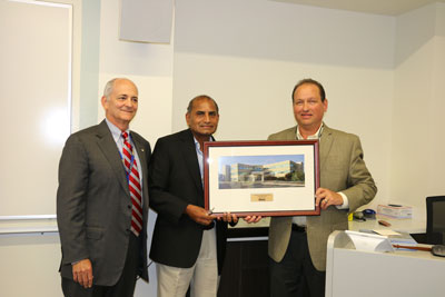 Dr. Peri presented with framed photograph by Mr. Fried and Dr. Peet