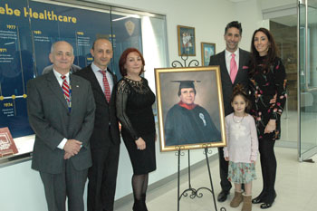 Mr. Fried, Dr. Helou, Shirin Saberi & Saberi children gather around Dr. Mansour Saberi's Memorial Portrait