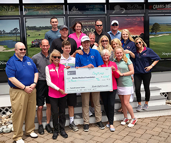 Members of Beebe Healthcare, Beebe Medical Foundation, and the Michael A. Ruddo Foundation present the health system with a $10,000 donation from the annual golf tournament in May.