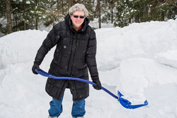 Woman Shoveling Snow