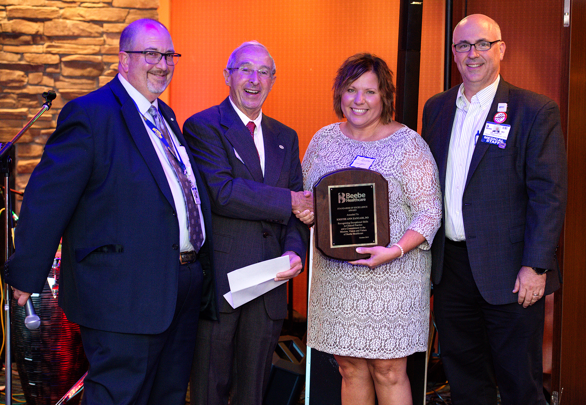 Shown during the physician award presentation, left to right, are Rick Schaffner, Interim CEO, Executive Vice President, and COO; David Herbert, Chair of Beebe Board of Directors; Kristie Zangari, DO, and Jeffrey Hawtof, MD, VP of Medical Operations.