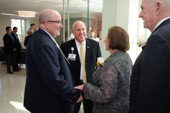 Rick Schaffner, Executive Vice President of Beebe Healthcare and Tom Protack, Vice President of Development for Beebe Medical Foundation talk to Margaret H. and Randall Rollins following the event.