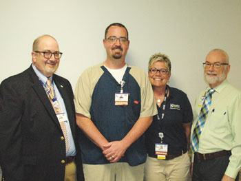 Joshua Bumgarner, MRI technician at Beebe Healthcare (second from left), is the May 2018 recipient of the L.O.V.E. Letter Award. Also pictured are Rick Schaffner, Executive Vice President and Chief Operating Officer (far left), Abigail Mead, Manager, Diag