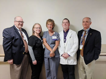 Kathi Dayton, Pulmonary Technician at Beebe Healthcare (center) is the July 2018 recipient of the L.O.V.E. Letter Award. Also pictured from left to right are Rick Schaffner, Executive Vice President and Chief Operating Officer; Sara Brown, Respiratory Man