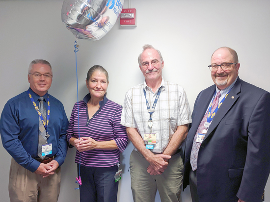 Tina Flatch is the recipient of Beebe Healthcare’s October 2019 L.O.V.E. Letter. Also pictured from left to right are Clint Perkinson, Director of Information Services; Brad Travis, Technology Manager; and Rick Schaffner, Interim CEO, Executive VP