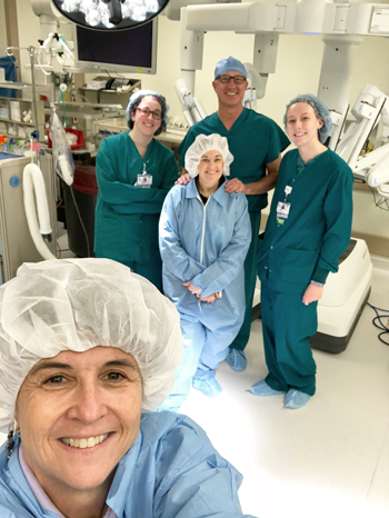 P.S. Enjoy this photo of me with members of our Center for Robotic Surgery team (in back) and Carolyn Watson, our cover photographer for this issue (in front).