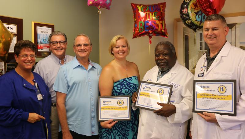 Celebrating Excellent Cardiac Care are (l-r) Moira Quint, office coordinator; David Nelson and Bill McManus; Dawn Snyder, RN-ICU; Dr. M. Ray Kuretu, cardiothoracic surgeon; and Brian McCarthy, PA-C. Celebrating Excellent Cardiac Care are (l-r) Moira Quint, office coordinator; David Nelson and Bill McManus; Dawn Snyder, RN-ICU; Dr. M. Ray Kuretu, cardiothoracic surgeon; and Brian McCarthy, PA-C.