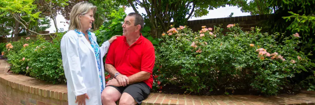 An oncology nurse talks to a patient