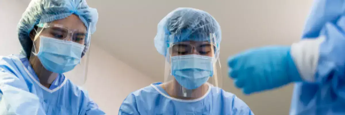 medical professionals in ppe help a patient