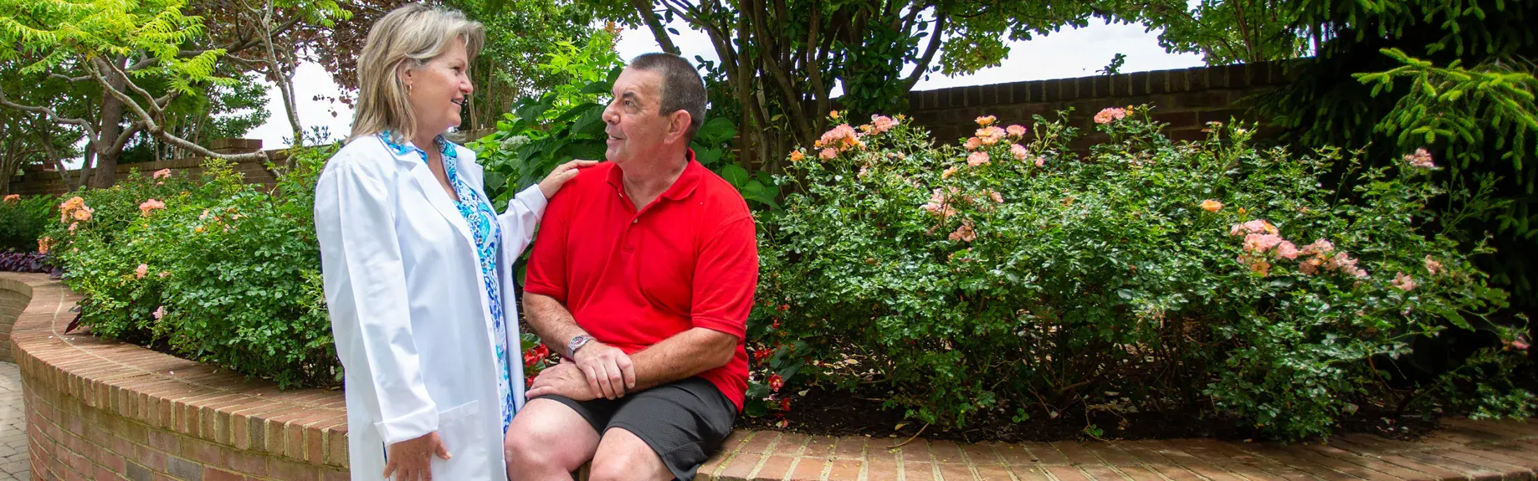 An oncology nurse talks to a patient
