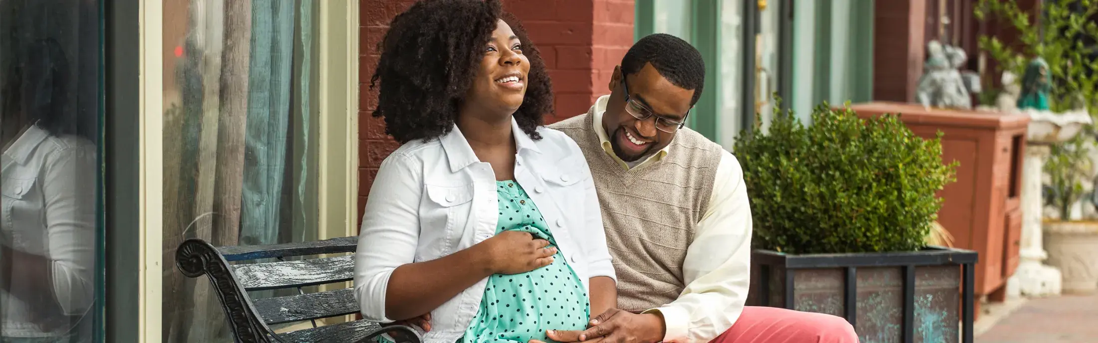 Pregnant woman and husband enjoying sunshine