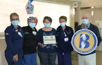 Bob Harmon, right, celebrates the care he received at Beebe with nurses (l-r) Jennifer Maxwell and Colleen Dudlek, his wife Kathy Harmon and PA-C Tricia Ecker.