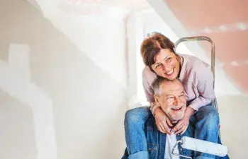 A couple painting their home