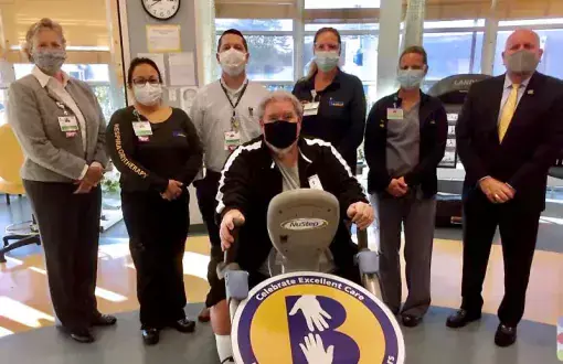 Celebrating Pete Harrigan’s donation to cover the cost of a new NuStep machine at Beebe’s Pulmonary Rehabilitation Program are (l-r) Kay Young, Cindy Blemle, Chris Steele, Kelly Thompson, Cindy Adkins and Tom Protack, with Harrigan on the machine in front.