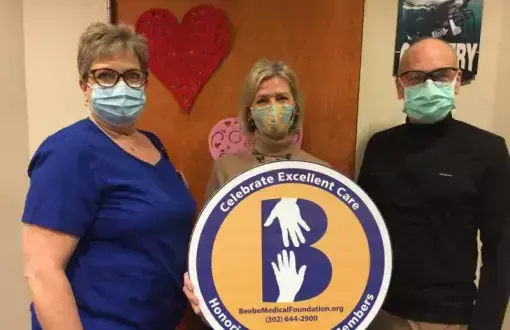 Beebe Health Sciences Librarian Jean Winstead, center, celebrates the excellent care - and unexpected diagnosis - she received from Dr. James Spellman and Mary Spradlin, his nurse. Shown are (l-r) Spradlin, Winstead and Spellman.