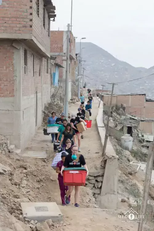 Students carry supplies