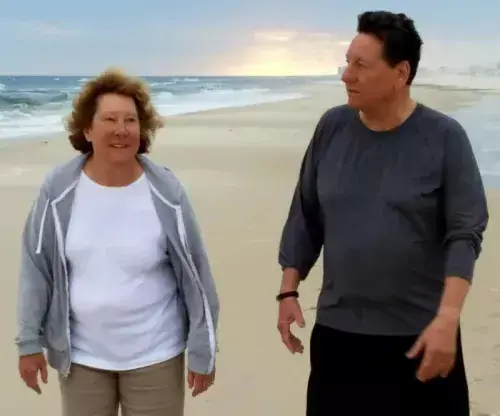 Sharon Keegan-Coppels and Preston Coppels enjoy one of their many walks on the beach. This photo was taken prior to the COVID-19 pandemic and prior to cloth mask regulations.