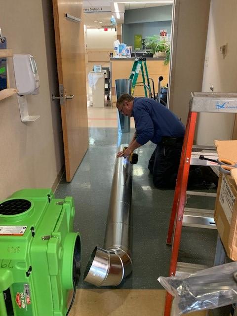 Jack Kirkpatrick assembles duct work for third floor of the Margaret H. Rollins Lewes Campus.