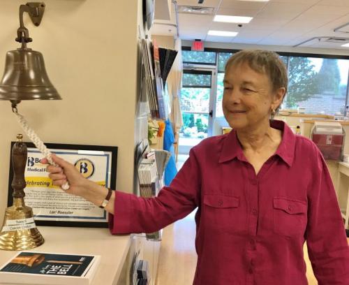 Kim King rings the bell at Tunnell Cancer Center to celebrate her last chemotherapy treatment.