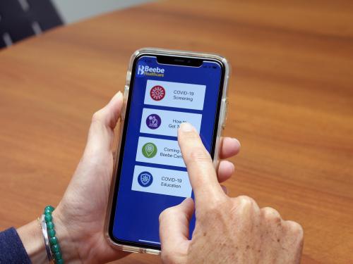 Download the COVID Screening App on your smartphone.