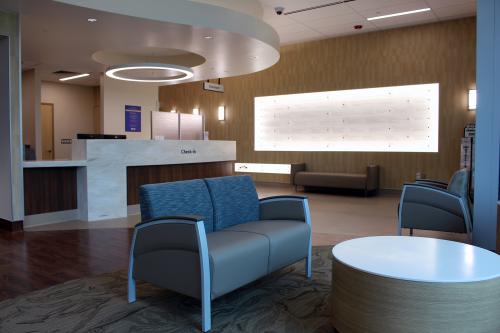 The donor wall shines bright in the new lobby of the South Coastal cancer center.
