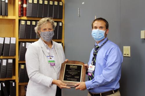 Kay Young of Beebe Medical Foundation presenting the Philanthropy Award to Dr. Bill Chasanov.