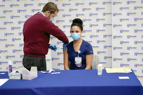 Sintia Rodriguez, RN, is the first to receive the COVID-19 vaccine in Sussex County, Delaware.