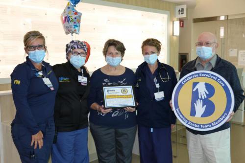 Bob Harmon, right, celebrates the care he received at Beebe with nurses (l-r) Jennifer Maxwell and Colleen Dudlek, his wife Kathy Harmon and PA-C Tricia Ecker.
