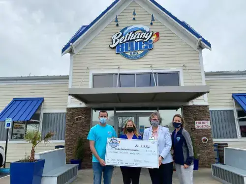 Bethany Blues donation.jpg Dave Grove, Bethany Blues General Manager, Amy Popovich, Beebe Medical Foundation Events Coordinator, Kay Young, Beebe Medical Foundation Executive Director of Development, Jessica Nathan, Bethany Blues Director of Operations