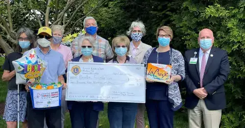 Kat Schmitz, President Lloyd Schmitz, Secretary Joanne Friend, member Kathy Engel, and Treasurer Michele Jessup. In the back are Beebe Medical Foundation Executive Director of Development Kay Young, Gift Officers Dave Szumski and Diane Barlow, and President Tom Protack.