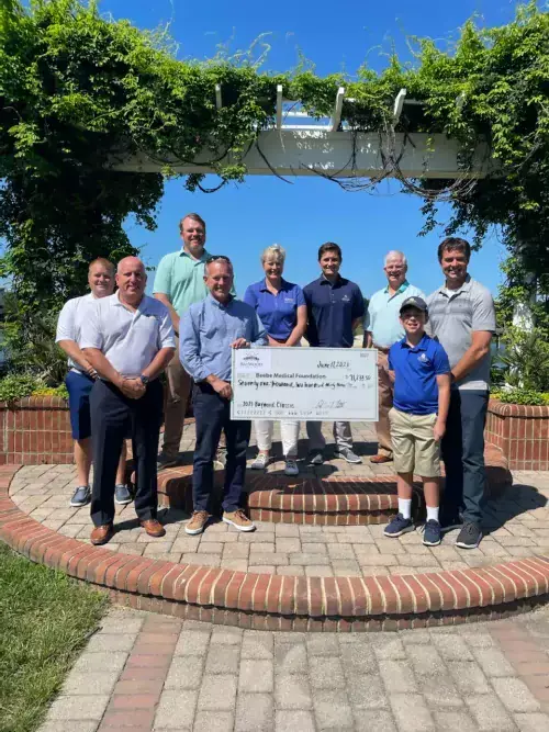 BaywoodClassic2021.CheckPresentation.jpg Tom Protack, Lincoln Davis, Jack Tunnell, Robert Tunnell in the first row. Justen Albright, Brad Travis, Kay Young, Corey Phillips, John Cavanaugh