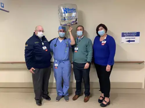 LOVE Letter - Michael Kalil.jpg Michael Kalil, D.O., Hospitalists in Beebe Healthcare’s Intensive Care Unit, (second from left) is the recipient of Beebe’s L.O.V.E. Letter Award for his efforts to make a difference for a patient and his wife. Also pictured from left to right are Rick Schaffner, Executive VP and COO of Beebe Healthcare, William Chasanov, D.O., VP and Chief Population Health Officer, and Chris Lowell, Manager of Inpatient Practice Operations.