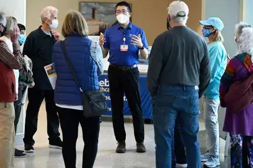 Dr Tam greets a tour group at the Specialty Surgical Hospital Open House