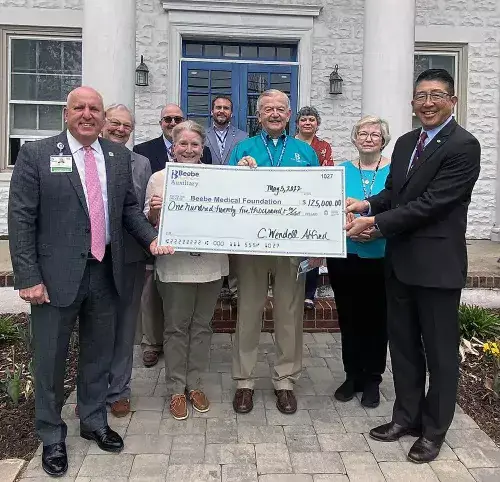 2022 - Auxiliary Check Presentation (June 2022).jpg Beebe Healthcare Receives $125,000 Donation from Its Auxiliary for Ultrasound Machine