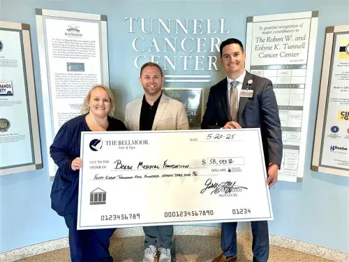 Caption: From left to right, Brittany Boleyn, MSN, RN with Beebe Oncology, Garth Huffman from Bellmoor Inn, and Sean Flanigan - Beebe Medical Foundation.