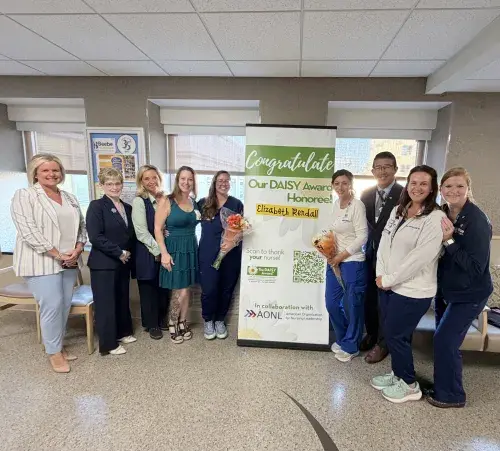 Photo, from left to right: Karen Pickard; Kathleen Tregear; Loretta Ostroski, nominator; Elizabeth Rendall, RN, DAISY Award winner; Christine Hess, nominator; Dr. David Tam; Jamie Dickerson; Dareth Penuel.